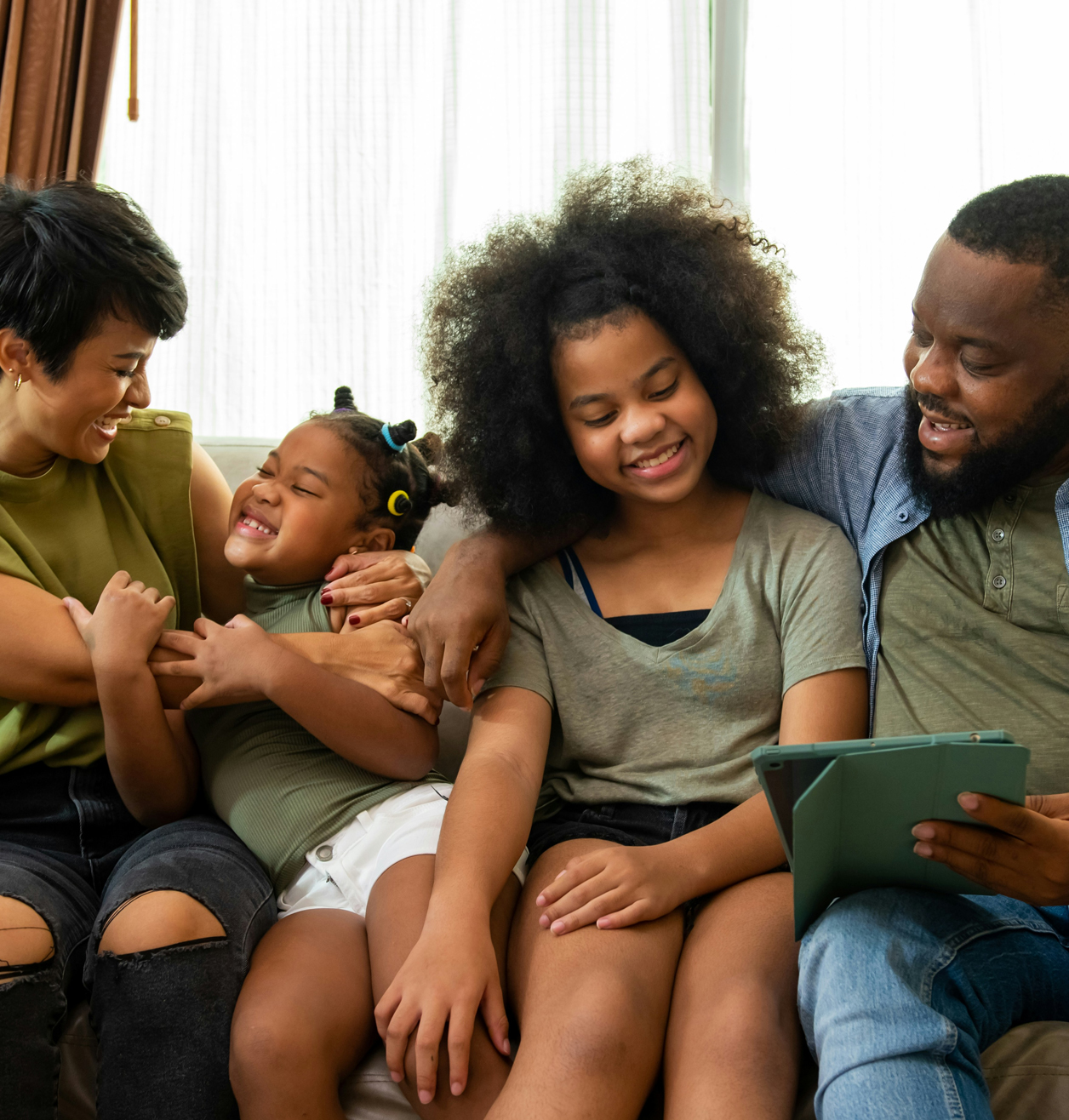 happy family sitting and laughing together